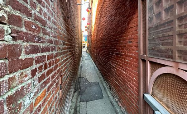 a narrow alley in victoria, b.c.'s fan tan alley.