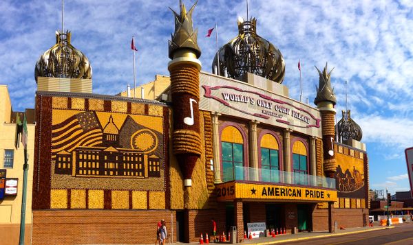 the world's only corn palace in Mitchell, SD. the building is ostentatious and tacky. red brick and thatched corn husk serve 