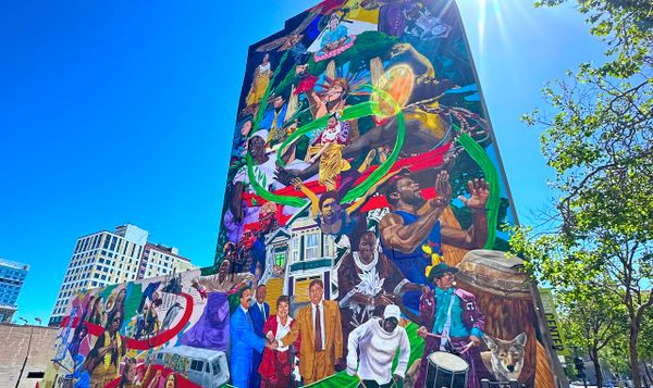 a mural in oakland, california containing dozens of cultural figures and places.