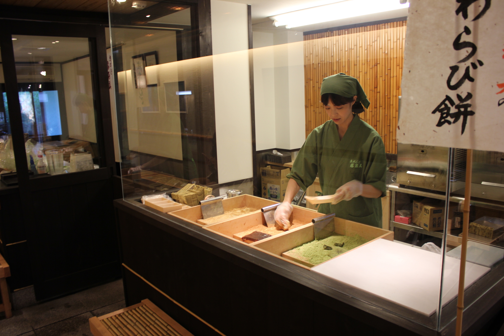 A Japanese chef making fresh dough for green tea dango
