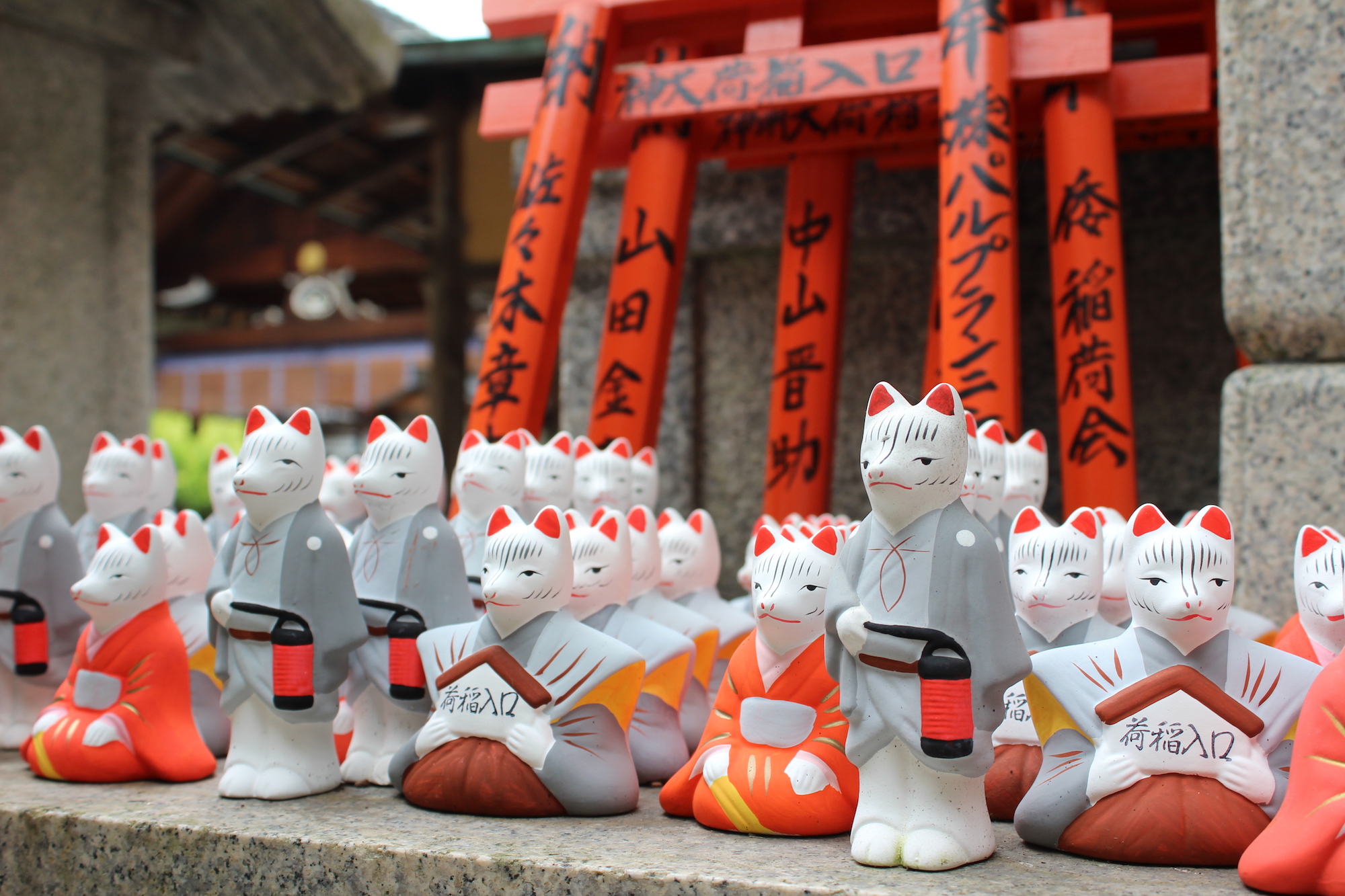 A group of fox figurines at Inari Jinja
