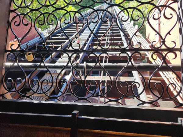 A steep track as seen through a metal grate