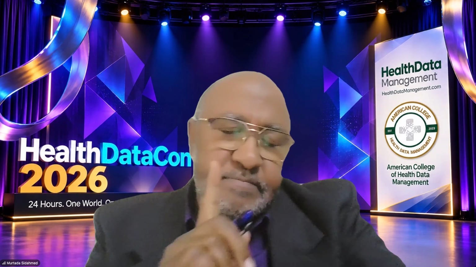 Murtada Sidahmed speaking during the Foundation Before Innovation panel at HealthDataCon 2026.