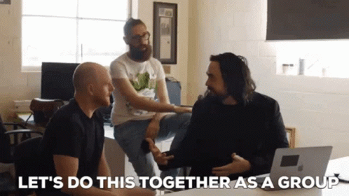 a group of men are sitting around a table with the words " let 's do this together as a group"