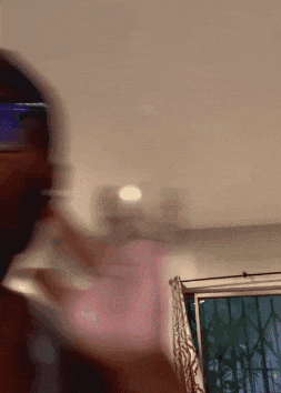 Repeating image of man with beard holding a finger up to his ear