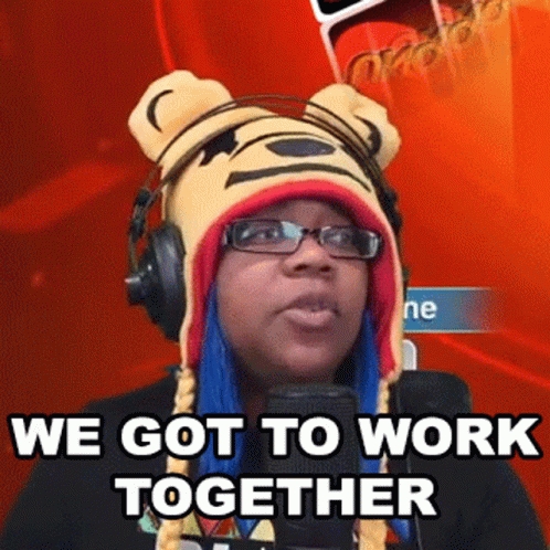 a woman wearing a bear hat and headphones says we got to work together