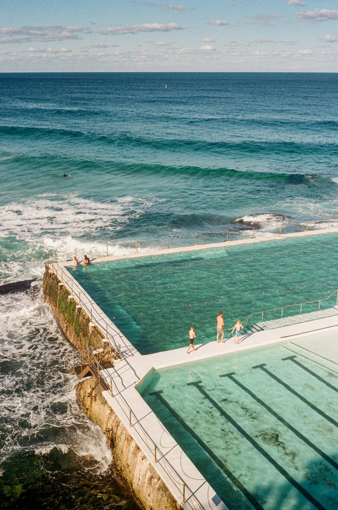 Bondi Icebergs, an ocean pool with swimmers and turquoise water surrounded by waves.