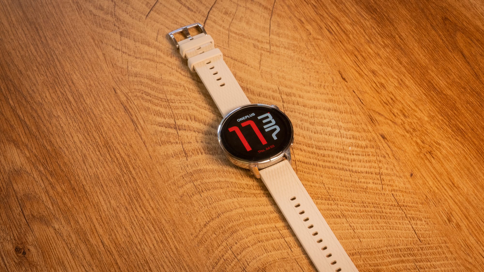 a photo of the oneplus watch laid out