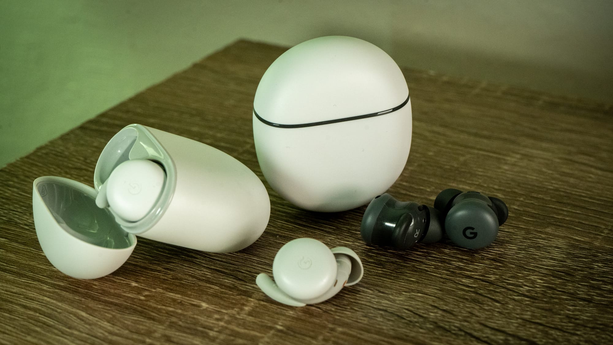 A photo of the Pixel Buds A-series and the Pixel Buds 2a for comparison.