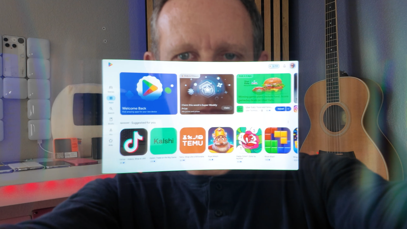 a photo of Jason with a screenshot of the Play Store interface floating in front of him 