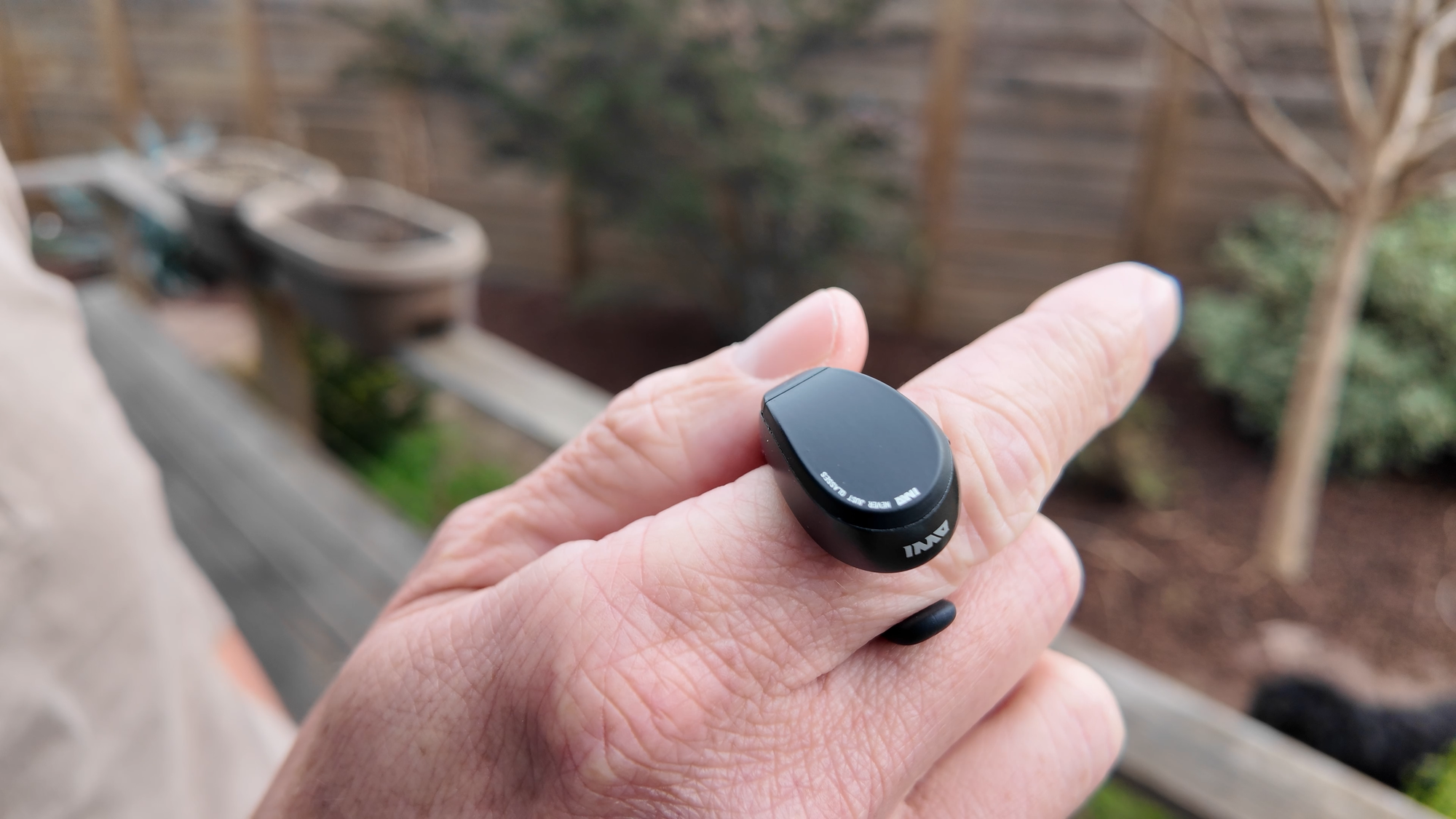 A photo of a person holding the ring controller