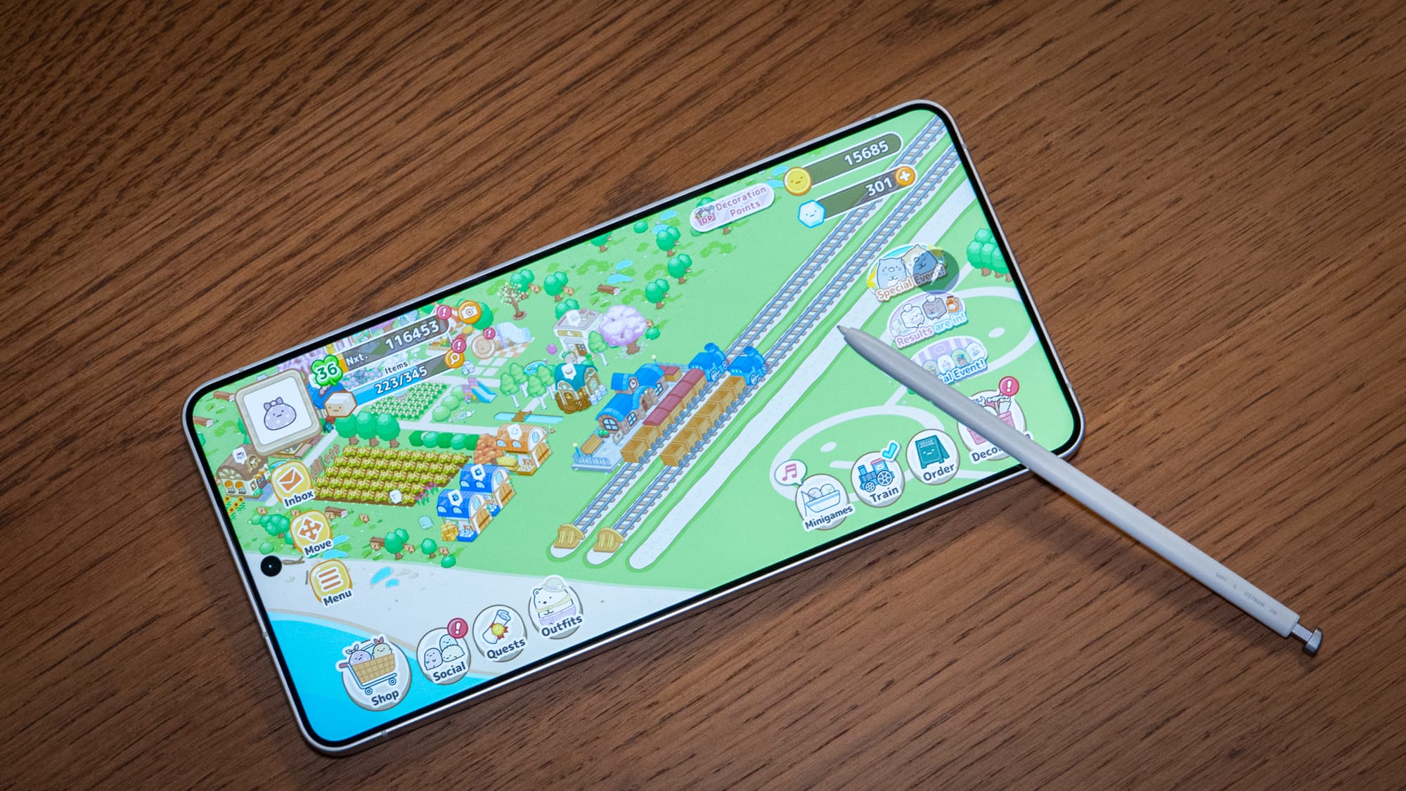 a photo of the S Pen resting on the Galaxy S26 Ultra, which is opened to Summiko Guarashi Farm