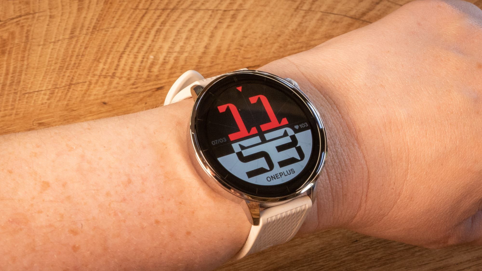 a photo of a person wearing the oneplus watch 3 in 43mm