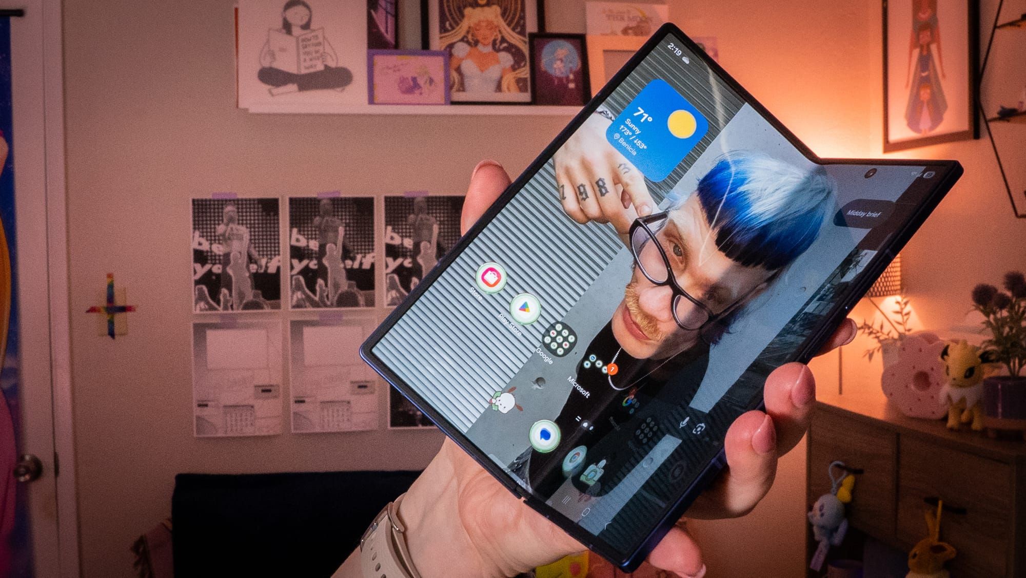 a photo of a person holding the z fold 7 slightly folded up