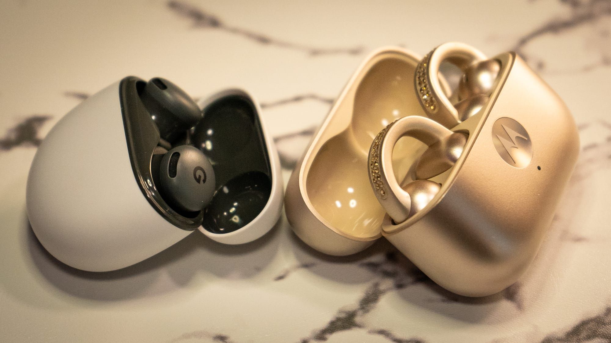 A photo of the Pixel Buds 2a and the Moto Bud Loops