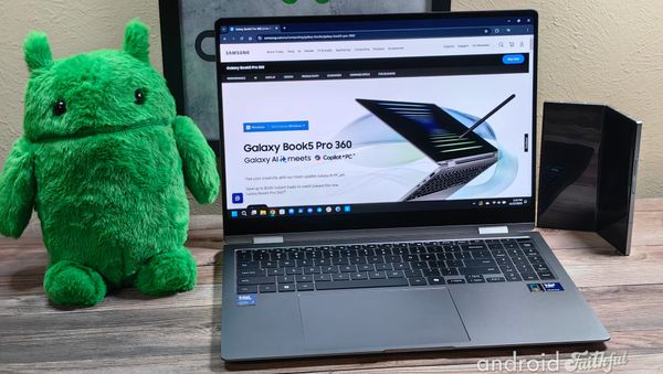 An Android plushie and Galaxy Z Fold 6 next to the Samsung Galaxy Book5 Pro 360 laptop.