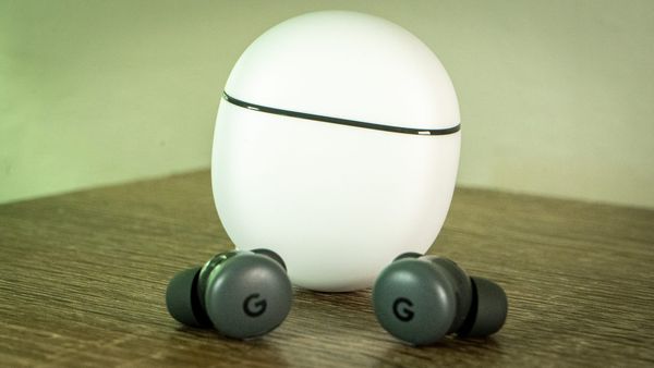 A photo of the Pixel Buds 2a case, upright, and the buds