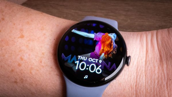 a photo of the madonna album cover confessions on a dance floor as the background of a pixel watch 4