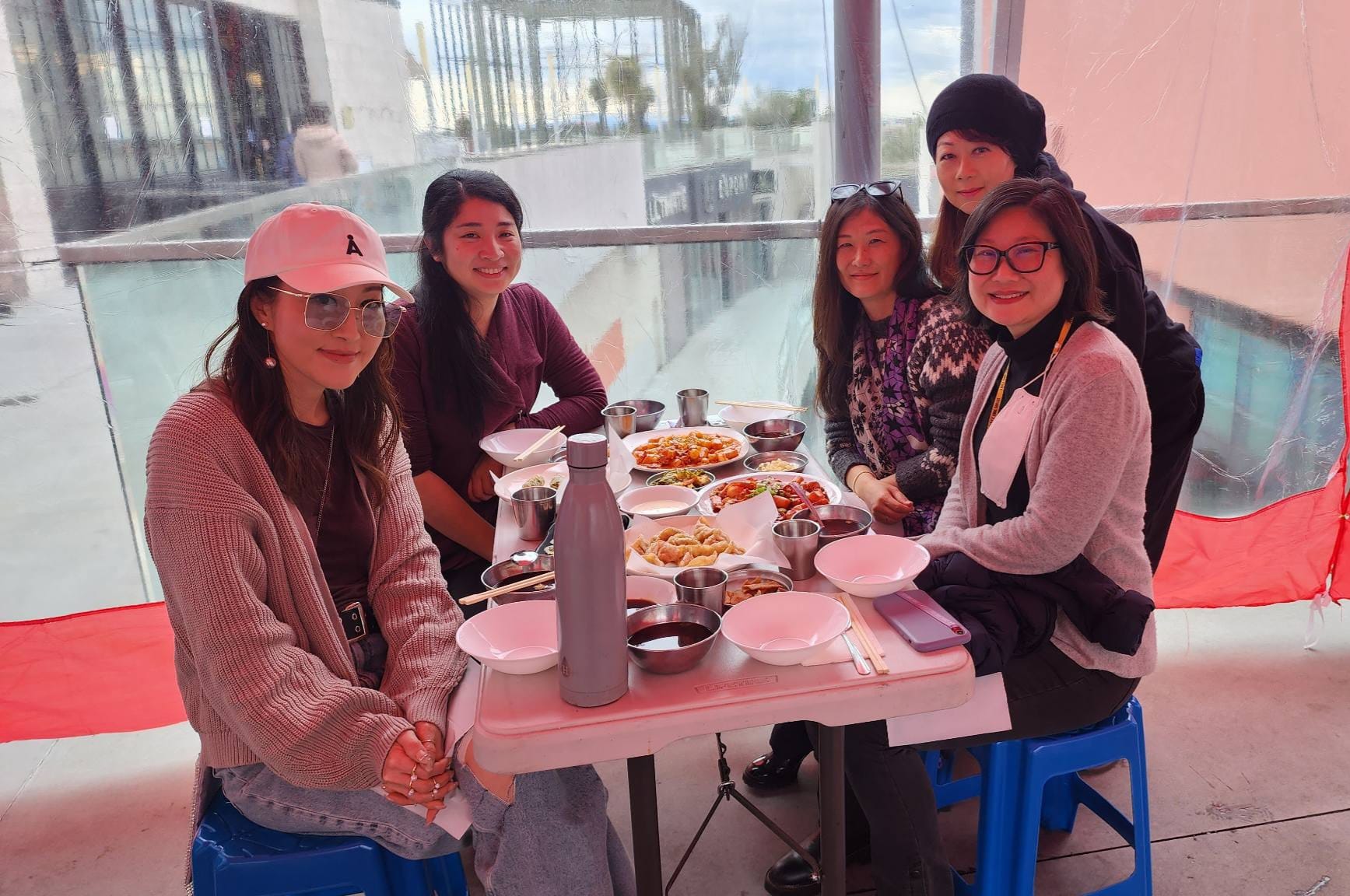 Former KoreAm Journal and Audrey Magazine editors Anna M. Park, Ada Tseng, Anne Kim-Dannible, Jiyoon Kim and Julie Ha sit around a table having lunch. Credit: Courtesy of Ada Tseng