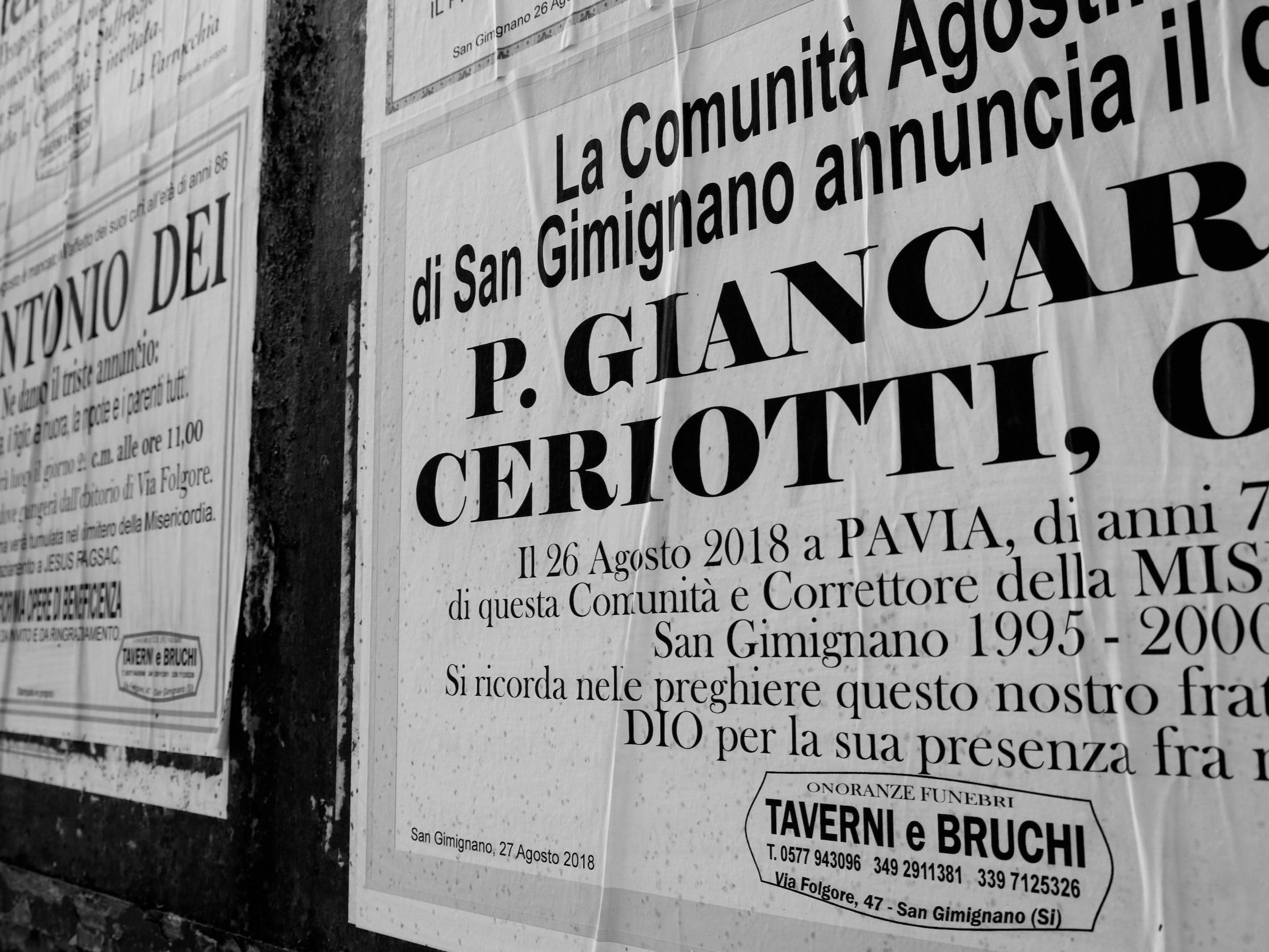 Posters with nice typography plastered on a brick wall