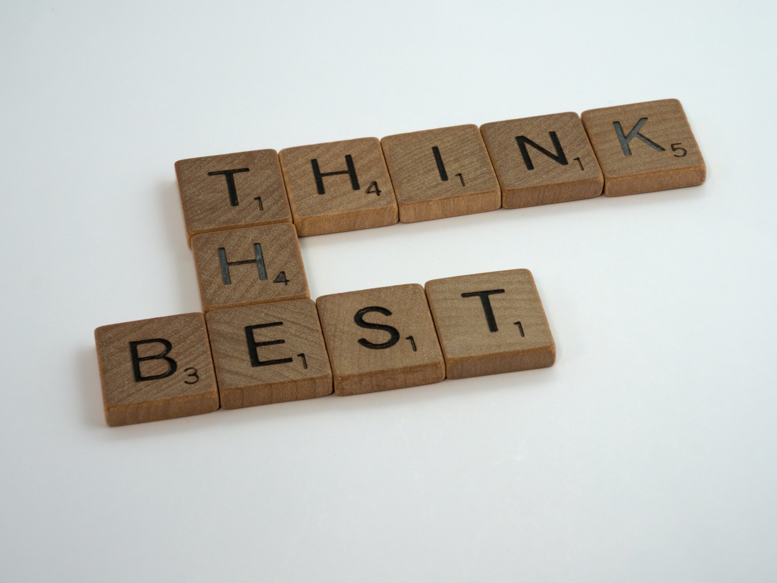 "Think The Best" is written in wooden letter tiles.