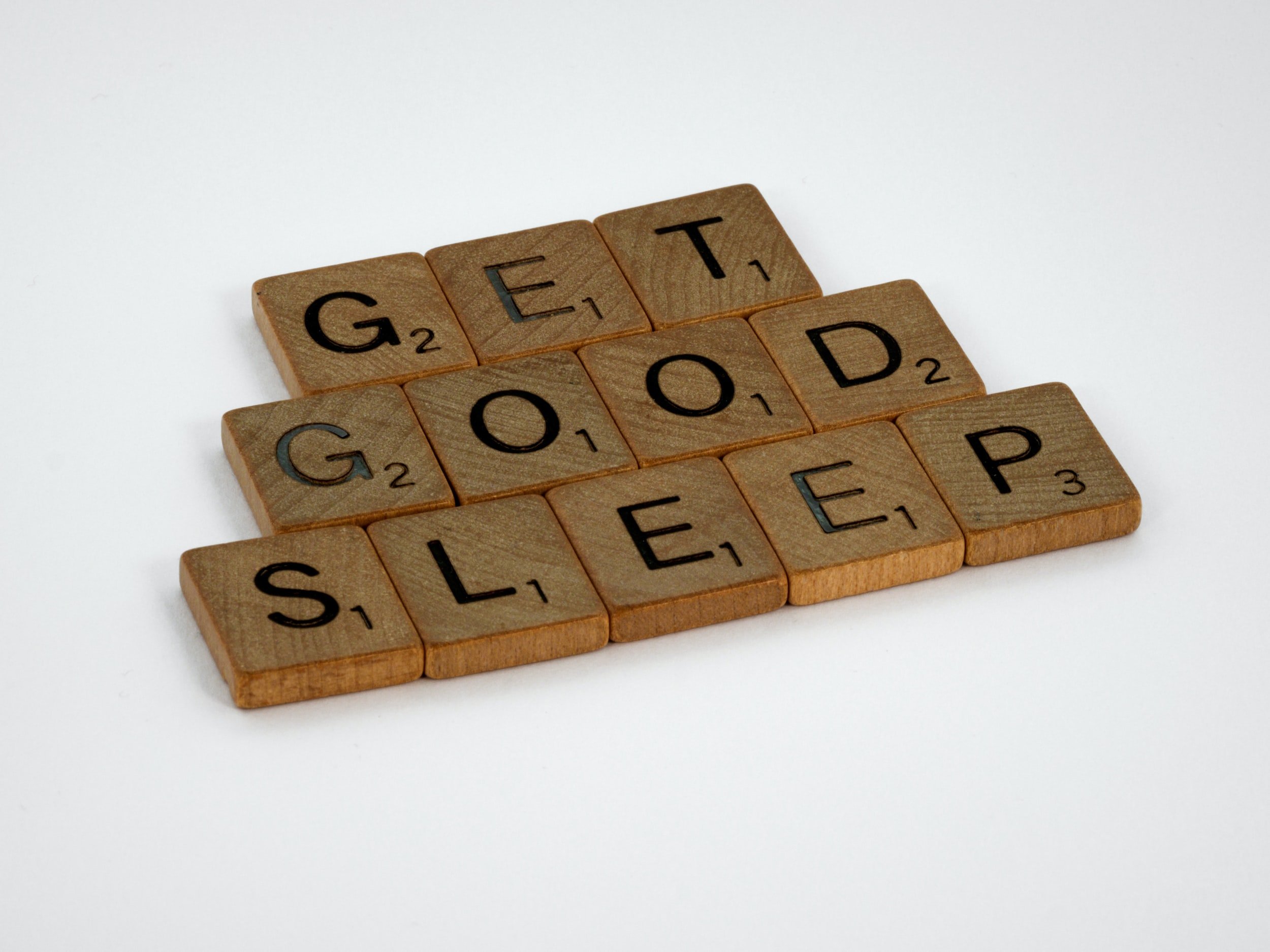 Wooden Letter Tiles Spell “Get Good Sleep.”
