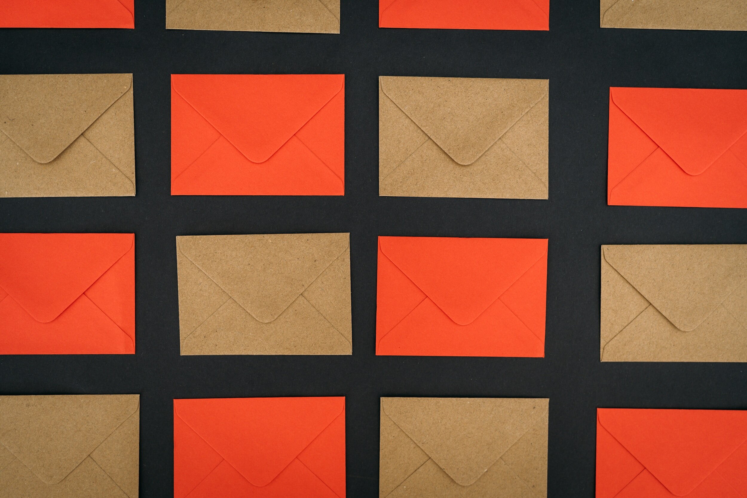 A display of brown and orange envelopes alternated.