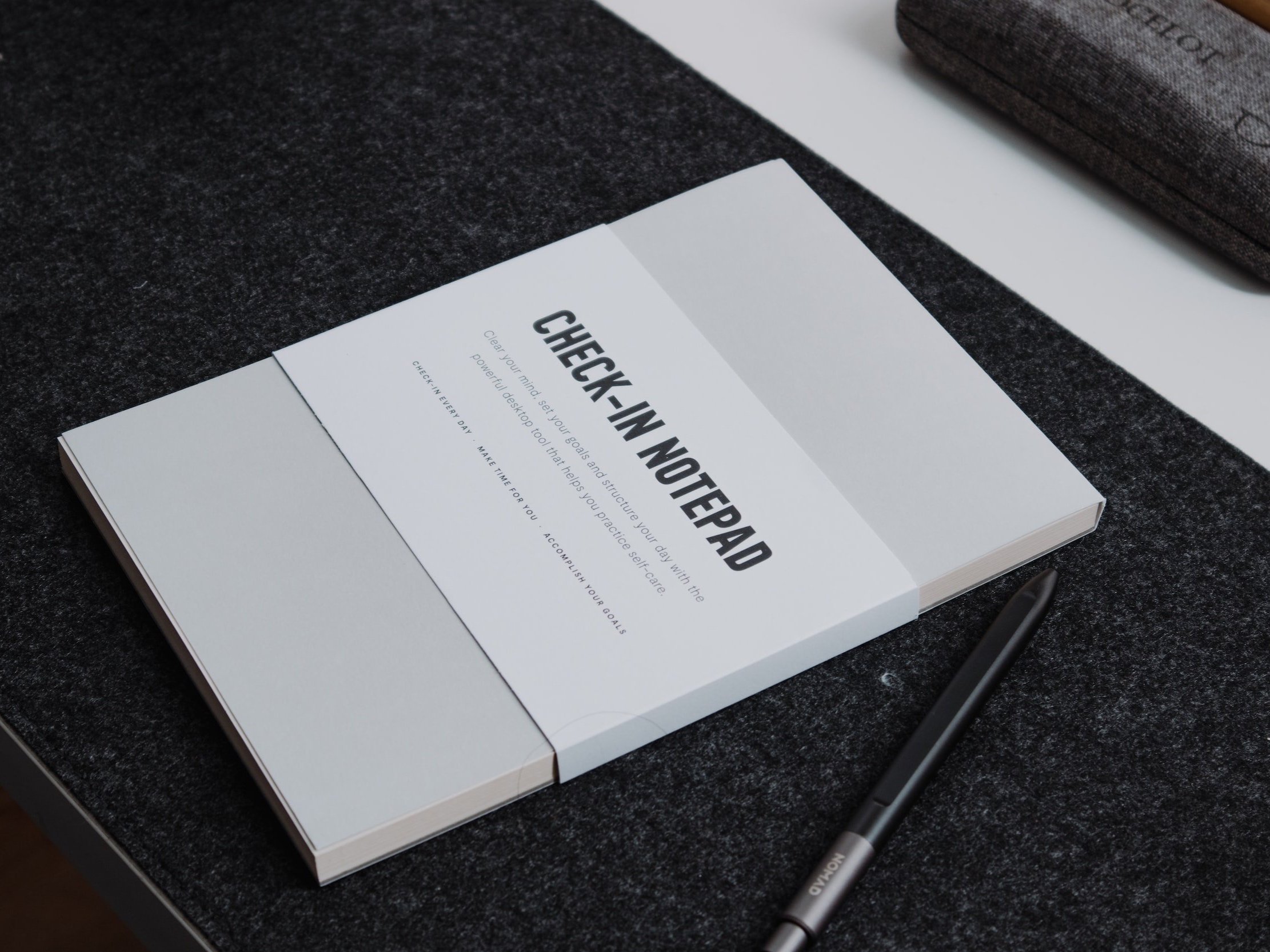 A new notepad is ready for goal setting.