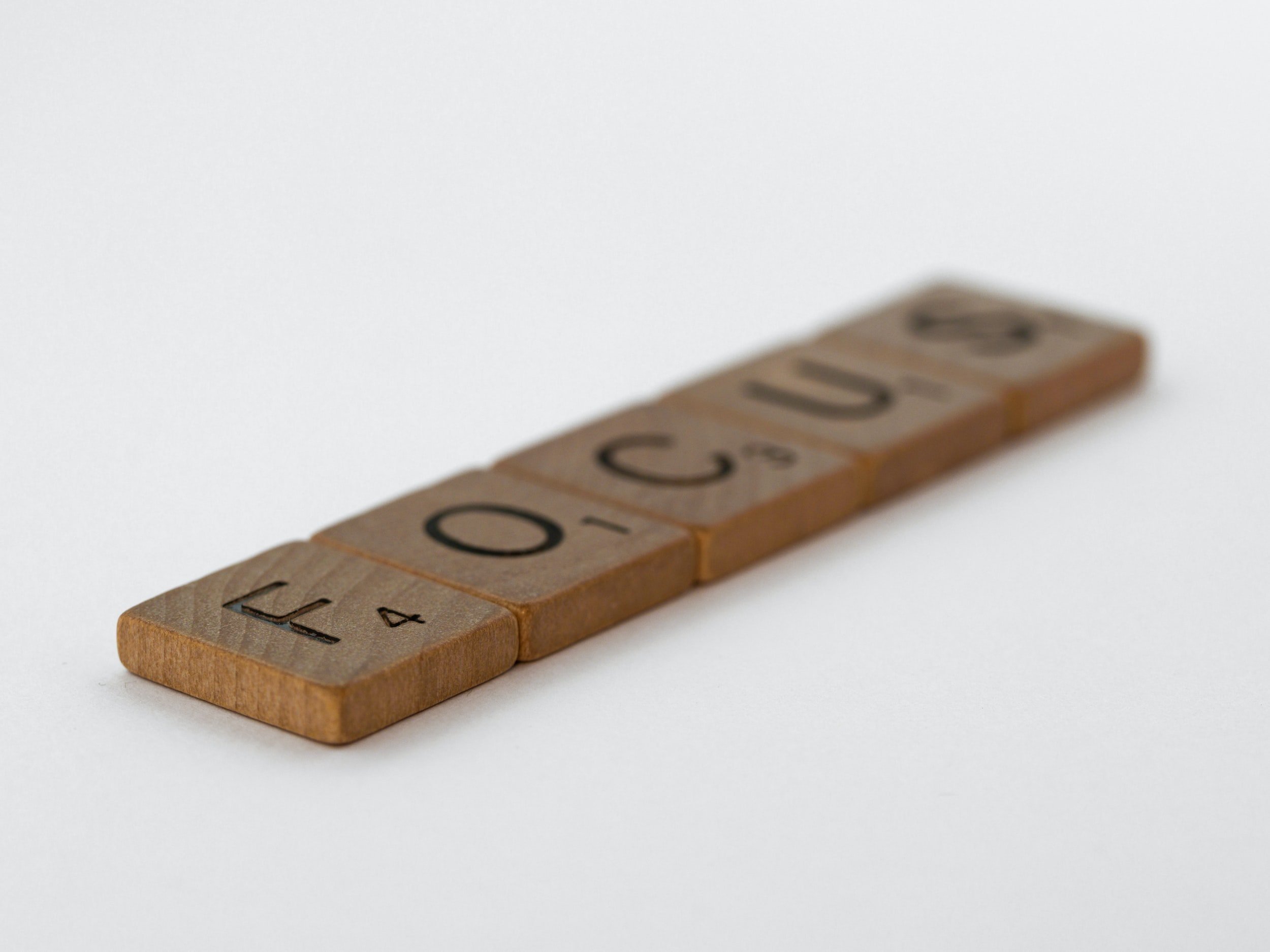 Wooden Letter Tiles Spell "Focus."