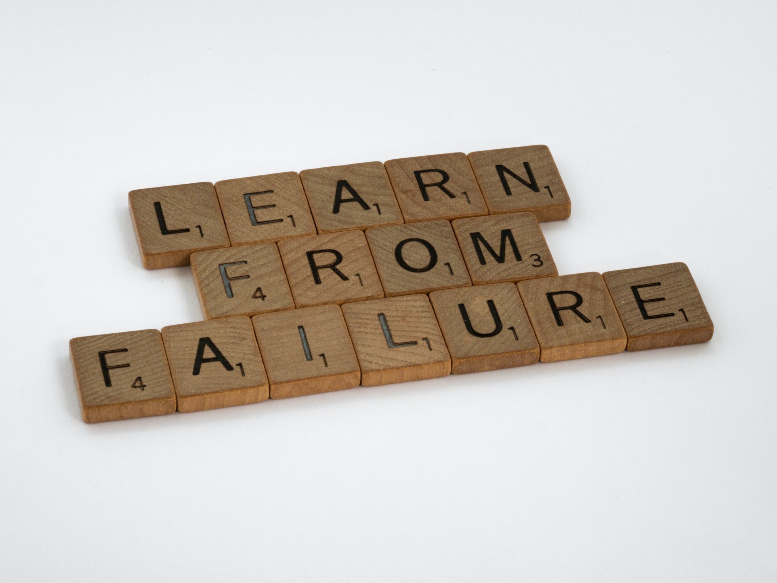 Wooden Letter Tiles Spell "Learn From Failure."