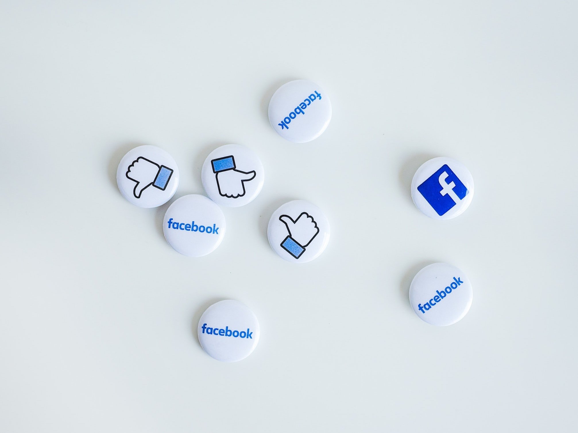 A variety of Facebook badge styles on a white background.