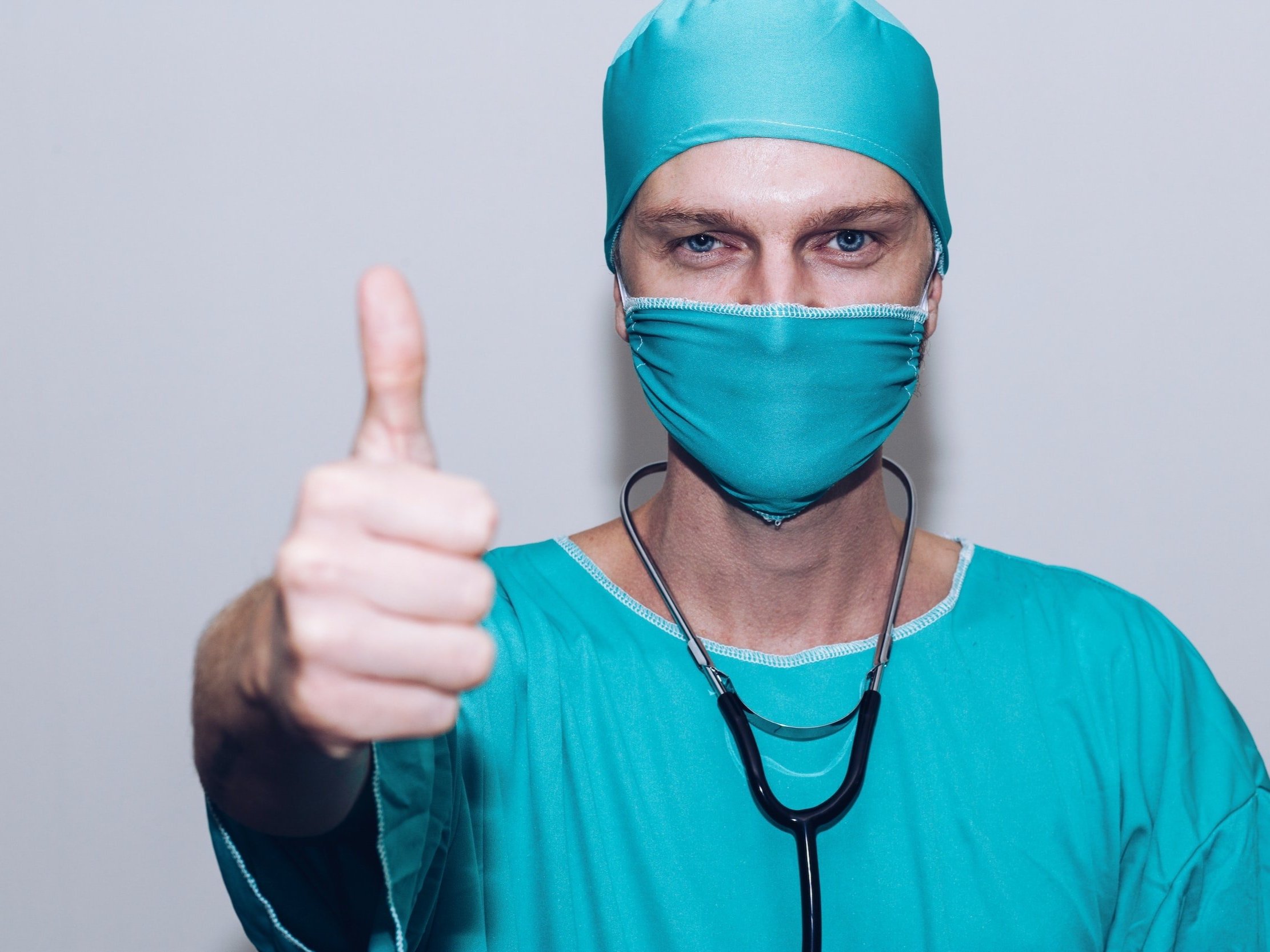 A surgeon gives a thumbs up.&nbsp;