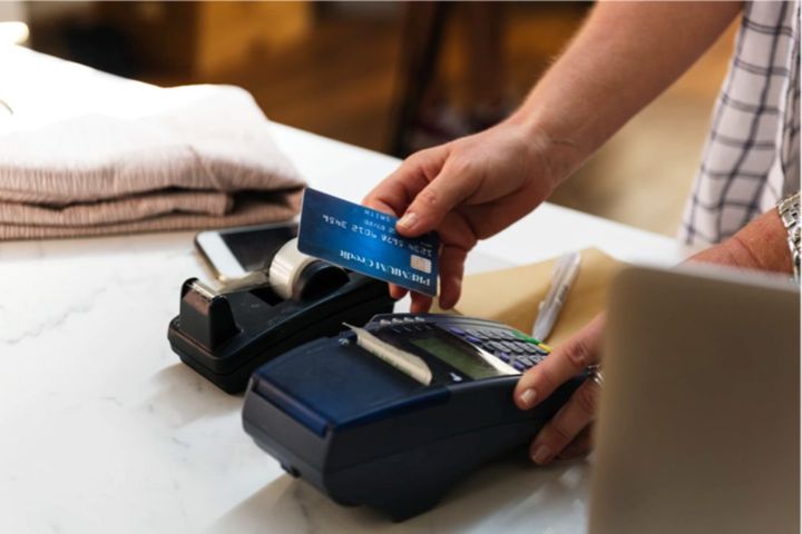 person paying with a credit card