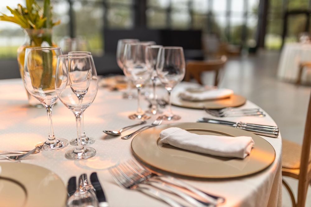 A set table with glassware in an elegant restaurant dining room