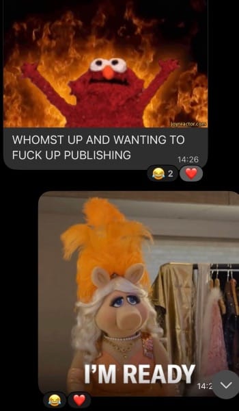 Screenshot of a text message exchange. One person has shared the GIF of Elmo standing in front of flames with the text "WHOMST UP AND WANTING TO FUCK UP PUBLISHING," while someone else has responded with a Miss Piggy GIF that reads "I'M READY"