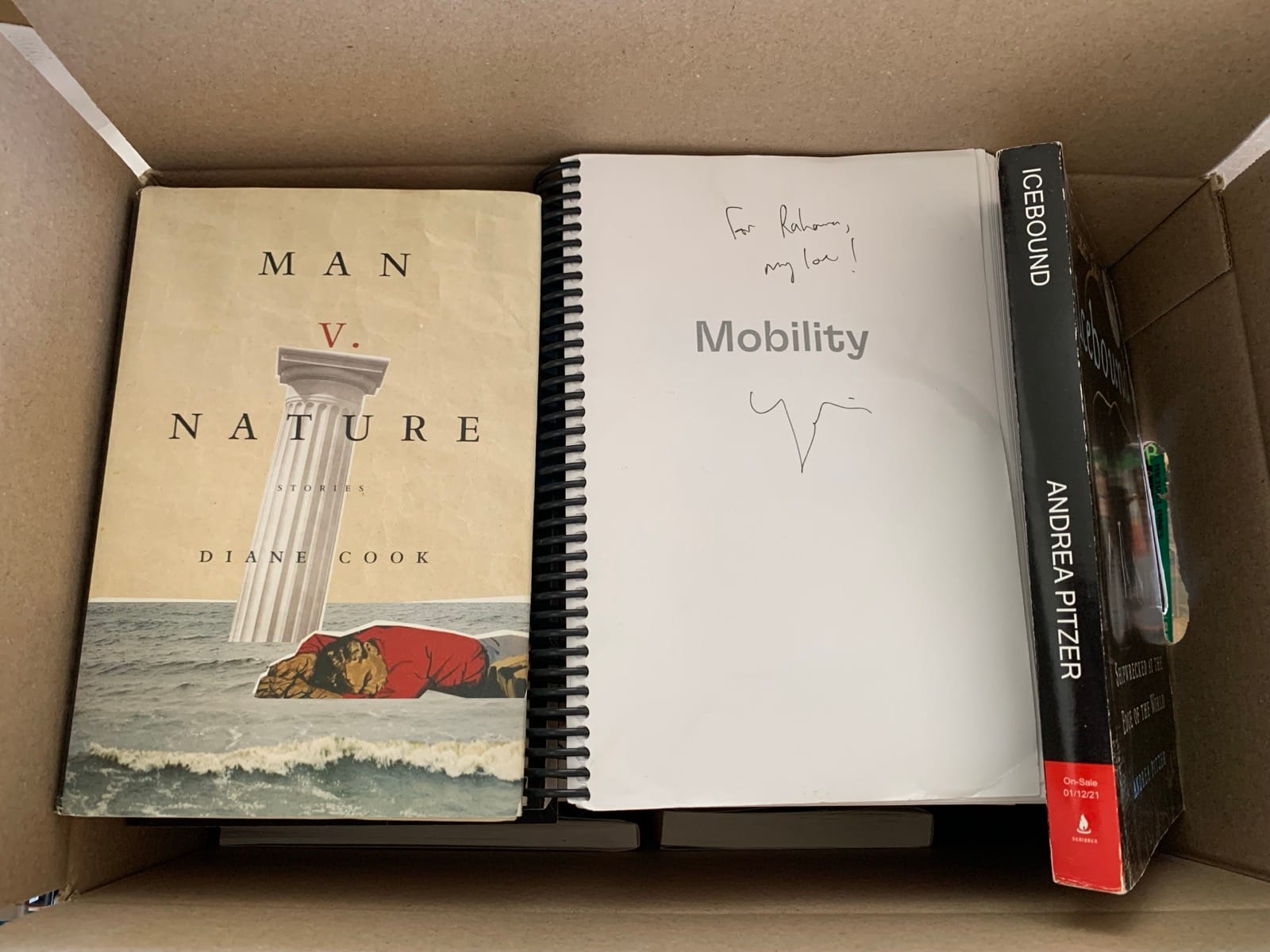 An overhead shot showing the covers for the three books mentioned in the caption.