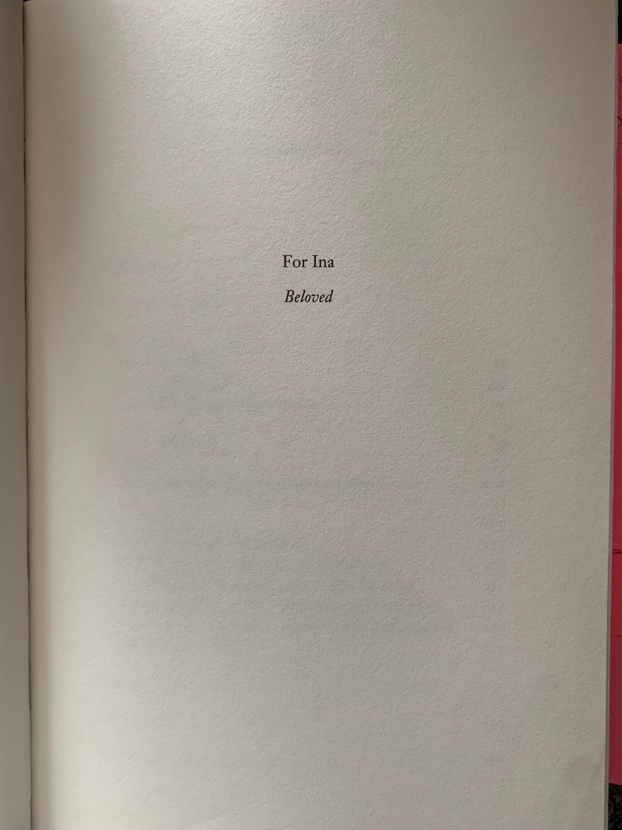 A white page in a book, with the words: "For Ina Beloved" in black type.