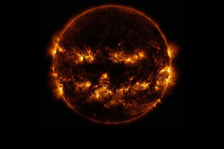 Active regions on the sun combined to look something like a jack-o-lantern’s face on Oct. 8, 2014.  📷 NASA/GSFC/SDO