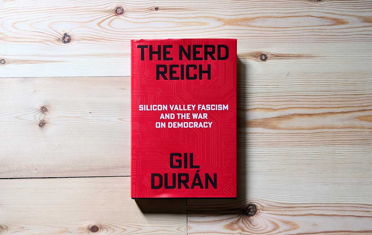 The cover of Gil Durán's The Nerd Reich, with white and black text on a crimson background.