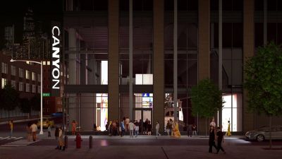 Night rendering of Canyon's Suffolk Street entrance, with a vertical CANYON sign and visitors gathered outside.