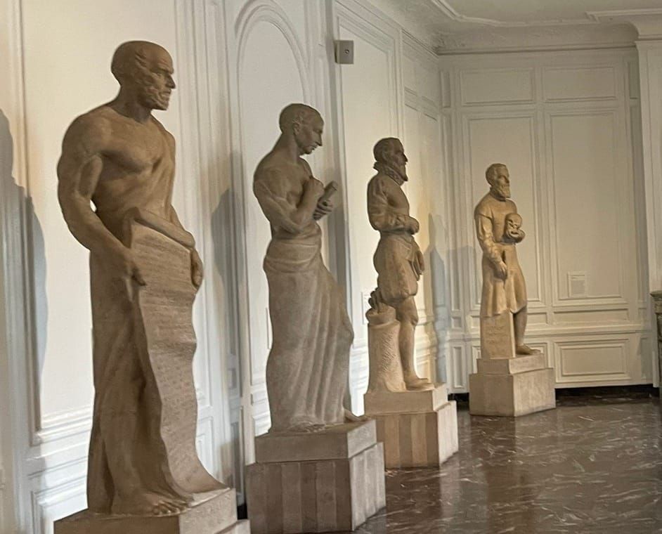 A photograph of medical statues displayed inside a physician's museum