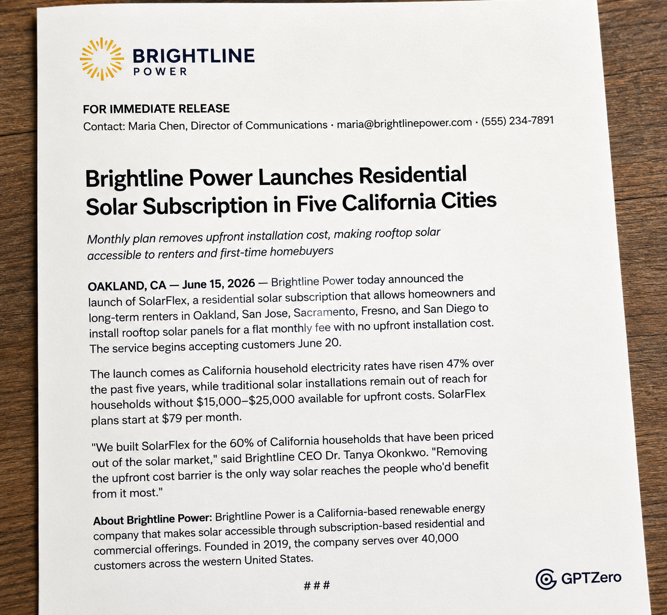 Mockup of a professionally formatted press release displayed on a clean white sheet of paper against a light neutral background.