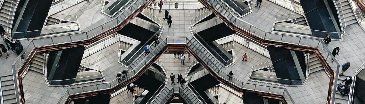 A complex collection of stairs and landings that looks like it could be impossible but isn't.