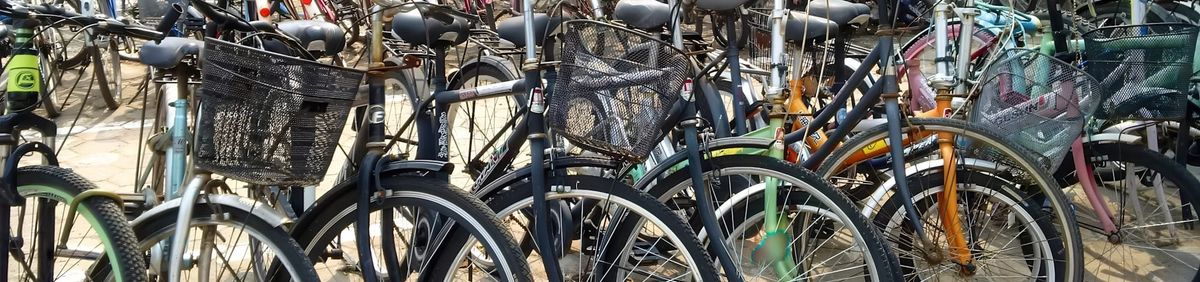 A row of bikes on a bike rack