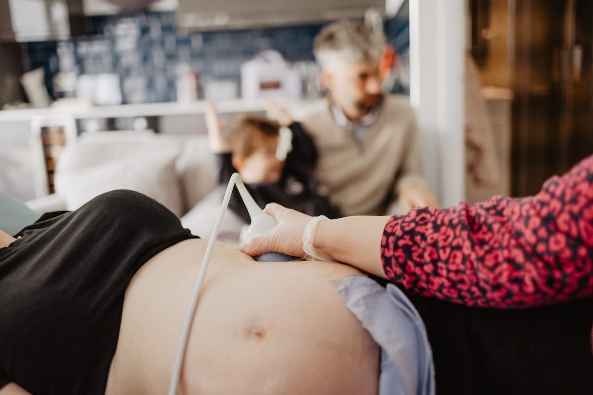 A parent having a private pregnancy scan at Sneak-A-Peek Ultrasound.