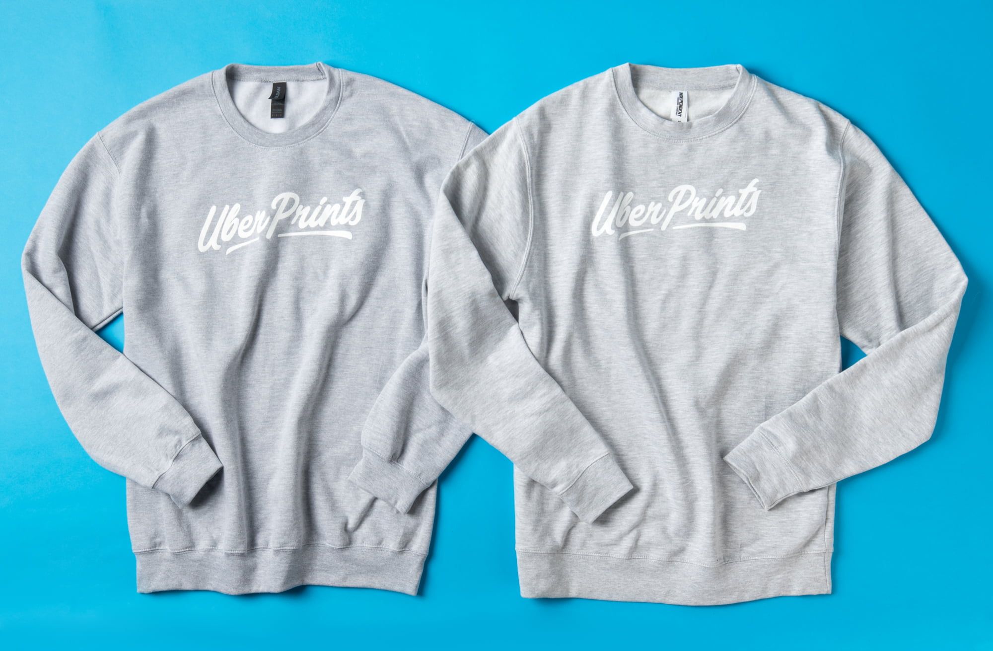 Flat top down view of the Basic Crewneck and the Premium Crewneck