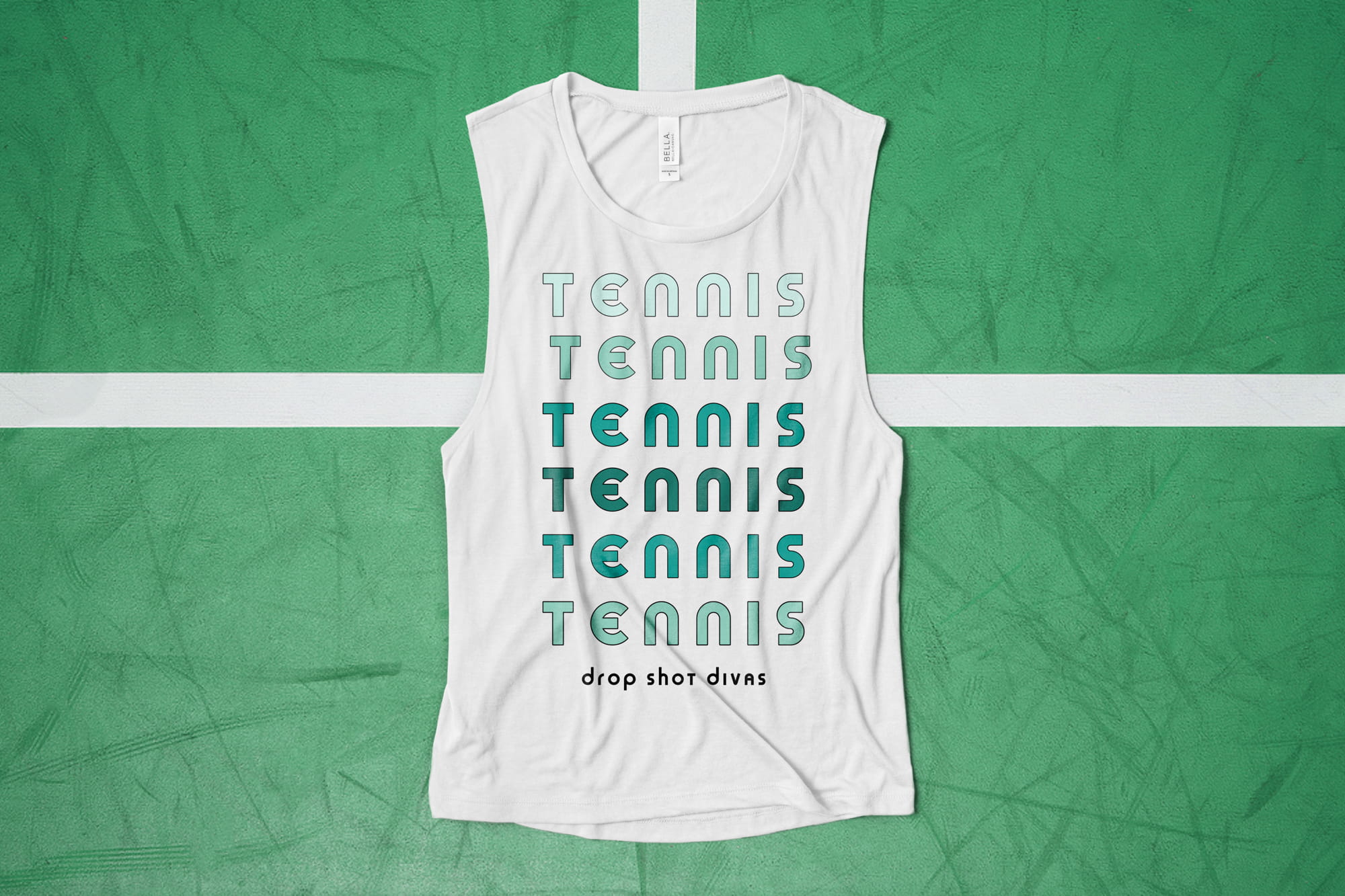 Flatlay of a white ladies muscle tank that has a bold graphic tennis themed design.