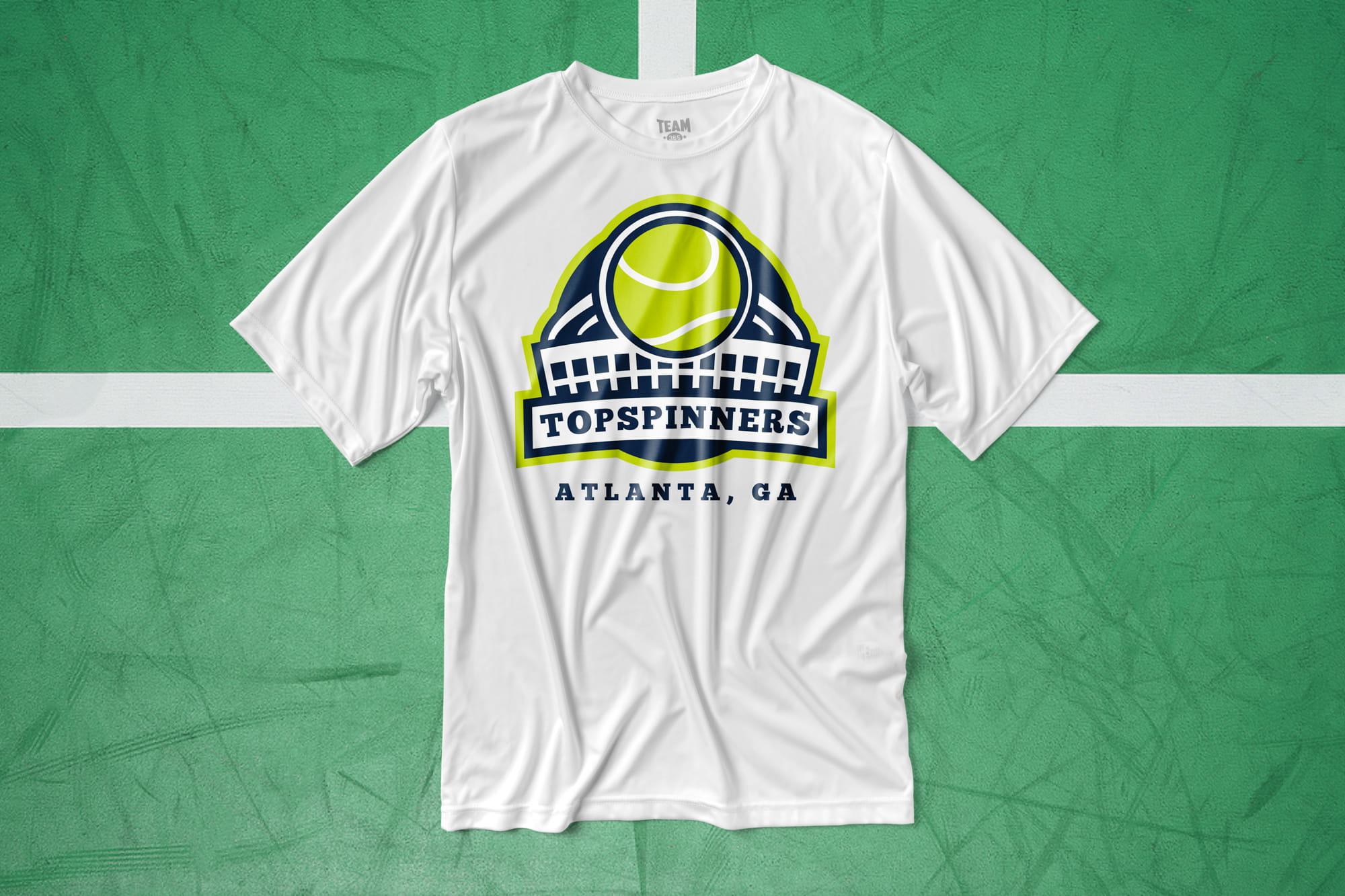 Flatlay of a white athletic shirt that features a tennis design.