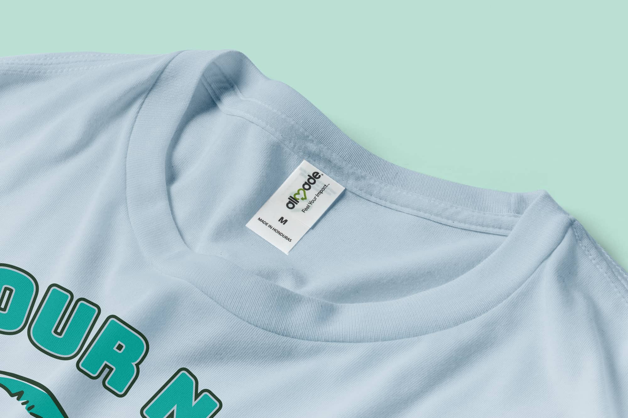A closeup of the collar and tag of the Allmade t-shirt.