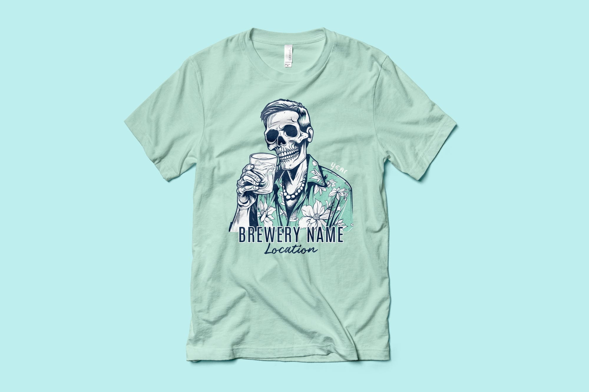 A light green shirt that shows a design of a skeleton in a tropical shirt with a drink in hand.